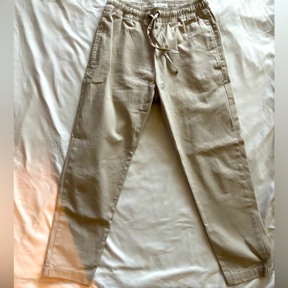 I Love Ugly cargo pants in beige. Size small. Adjustable waist band.